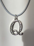 Q Necklace on Off White Cord